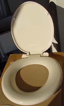 cream plastic toilet seat